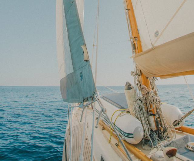 Shot of Front-End of Sailboat Sailing On Open Water