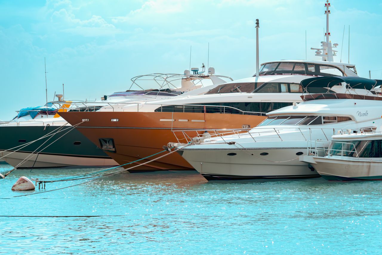 docked yachts in turquoise water